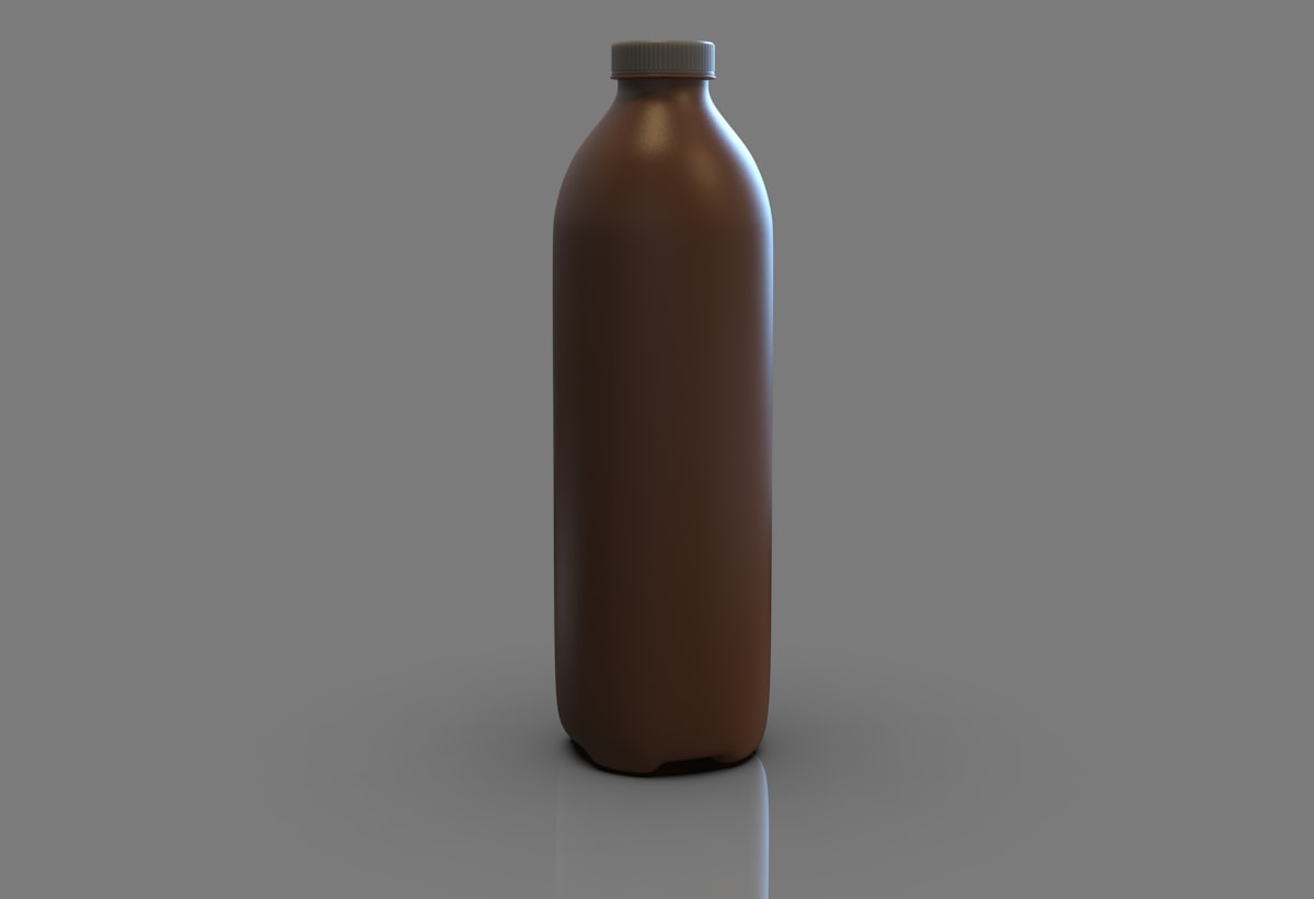 a brown bottle is shown on a gray background