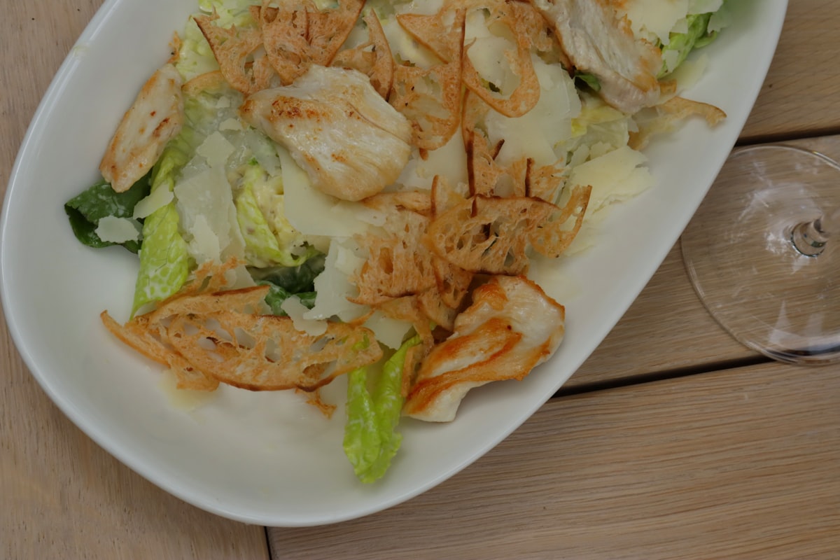 Fresh caesar salad with grilled chicken and crispy croutons